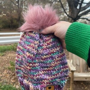 Hand knit beanie with faux fur pom pom